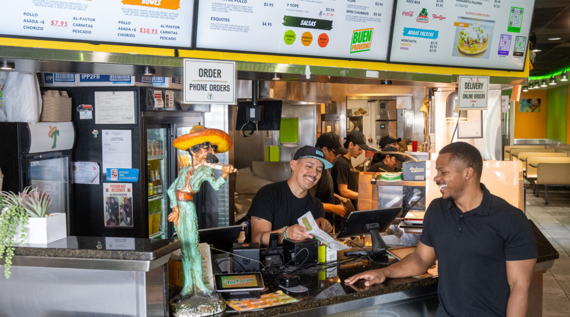 Visitors using interactive directory inside local business