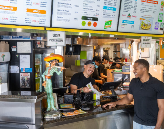 Visitors using interactive directory inside local business