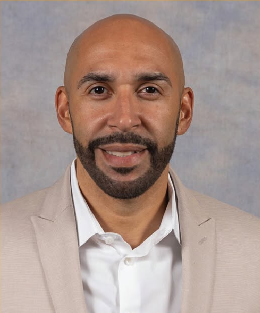 Professional headshot of Ruben Rosario