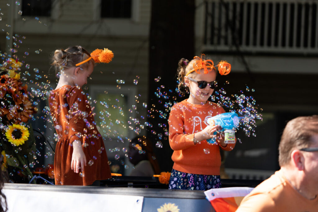 Child enjoying bubbles during community festival